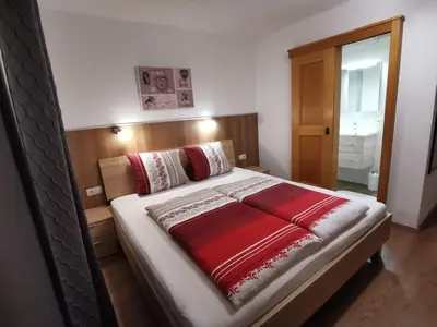 Ein Bett oder Betten in einem Zimmer der Unterkunft Gästehaus Jogglerhof