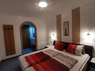 Ein Bett oder Betten in einem Zimmer der Unterkunft Gästehaus Jogglerhof