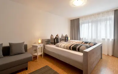 Ein Bett oder Betten in einem Zimmer der Unterkunft Ferienwohnungen Wies
