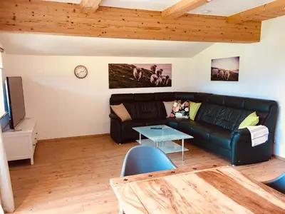 Ein Sitzbereich in der Unterkunft Ferienwohnung Zur Staffenbrugg