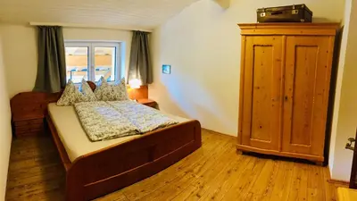 Ein Bett oder Betten in einem Zimmer der Unterkunft Ferienwohnung Zur Staffenbrugg