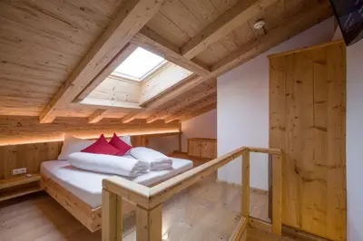 Ein Bett oder Betten in einem Zimmer der Unterkunft Postgasthof Fischerwirt