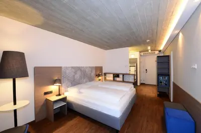 Ein Bett oder Betten in einem Zimmer der Unterkunft arte Hotel Kufstein