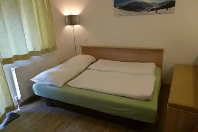 Ein Bett oder Betten in einem Zimmer der Unterkunft Ferienwohnung Loitfelder-Pang