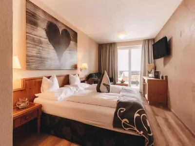 Ein Bett oder Betten in einem Zimmer der Unterkunft Boutique Hotel Haidachhof superior