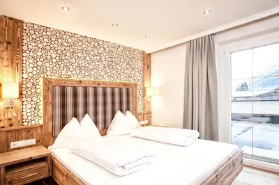 Ein Bett oder Betten in einem Zimmer der Unterkunft Hotel & Appartements Heigenhauser