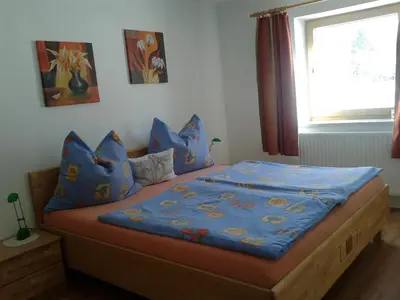 Ein Bett oder Betten in einem Zimmer der Unterkunft Häringer Mühle