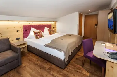 Ein Bett oder Betten in einem Zimmer der Unterkunft Hotel Talblick