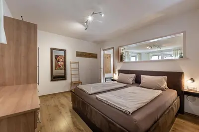 Ein Bett oder Betten in einem Zimmer der Unterkunft Ferienwohnung Alpenglück
