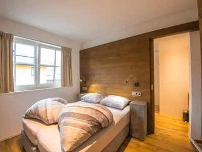 Ein Bett oder Betten in einem Zimmer der Unterkunft Modern apartment near the ski area