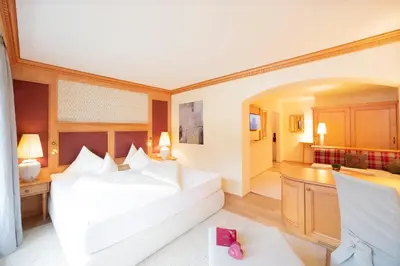 Ein Bett oder Betten in einem Zimmer der Unterkunft Wellnessresidenz Alpenrose