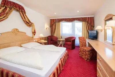 Ein Bett oder Betten in einem Zimmer der Unterkunft Hotel Jenbacherhof B&B