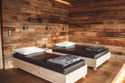 Ein Bett oder Betten in einem Zimmer der Unterkunft Farmhotel & Chalets Grosslehen