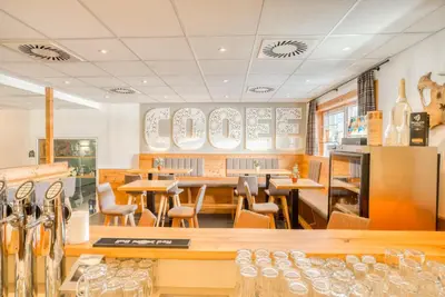 Ein Sitzbereich in der Unterkunft COOEE alpin Hotel Kitzbüheler Alpen