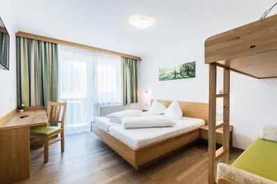 Ein Bett oder Betten in einem Zimmer der Unterkunft Gasthof Venedigerblick
