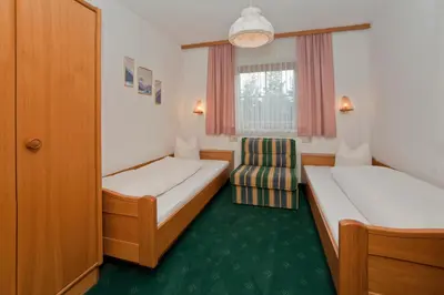 Ein Bett oder Betten in einem Zimmer der Unterkunft Pension Garni Appartement Ortner