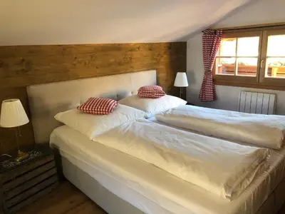 Ein Bett oder Betten in einem Zimmer der Unterkunft Chalet Tirolia