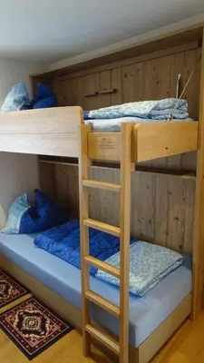Ein Bett oder Betten in einem Zimmer der Unterkunft Hoamatl