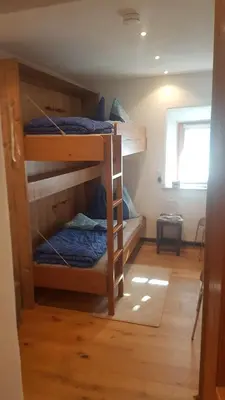 Ein Bett oder Betten in einem Zimmer der Unterkunft Hoamatl
