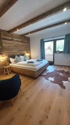 Ein Bett oder Betten in einem Zimmer der Unterkunft Alpenchalet Almrose