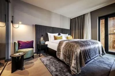 Ein Bett oder Betten in einem Zimmer der Unterkunft Grand Tirolia Kitzbühel - Member of Hommage Luxury Hotels Collection