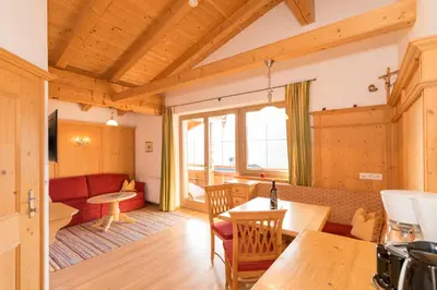 Ein Sitzbereich in der Unterkunft Das GÄSTEHAUS SCHNEIDER am Dorfplatz