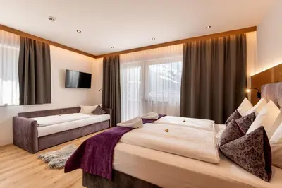 Ein Bett oder Betten in einem Zimmer der Unterkunft Hotel ALPINJUWEL 3-Sterne Superior