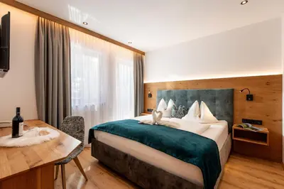 Ein Bett oder Betten in einem Zimmer der Unterkunft Hotel ALPINJUWEL 3-Sterne Superior