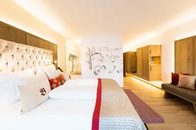 Ein Bett oder Betten in einem Zimmer der Unterkunft Sport-Wellnesshotel Bichlhof