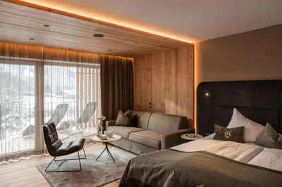 Ein Bett oder Betten in einem Zimmer der Unterkunft Sport-Wellnesshotel Bichlhof