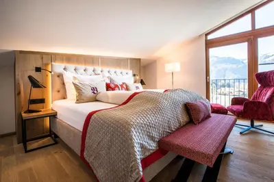 Ein Bett oder Betten in einem Zimmer der Unterkunft Sport-Wellnesshotel Bichlhof
