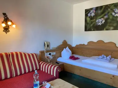 Ein Bett oder Betten in einem Zimmer der Unterkunft Hotel Metzgerwirt