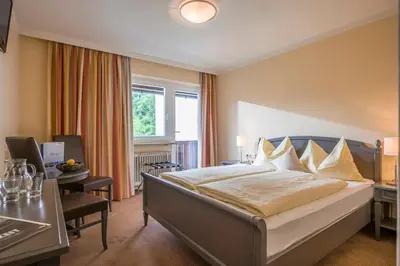 Ein Bett oder Betten in einem Zimmer der Unterkunft Sporthotel Austria