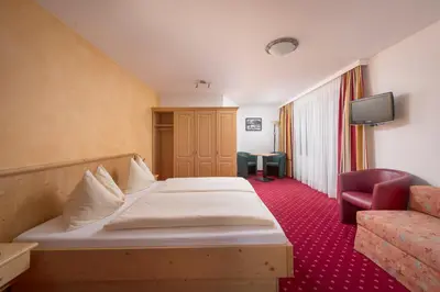 Ein Bett oder Betten in einem Zimmer der Unterkunft Hotel Fischer