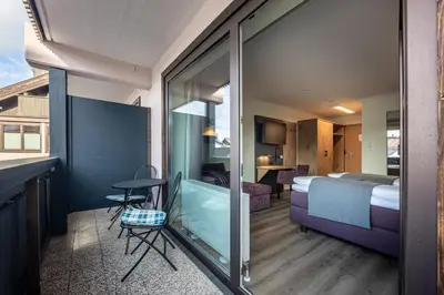 Ein Bett oder Betten in einem Zimmer der Unterkunft Hotel Fischer