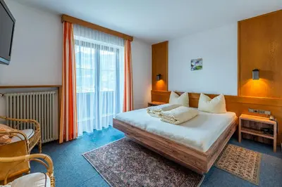 Ein Bett oder Betten in einem Zimmer der Unterkunft Wohlfühlhotel Schiestl