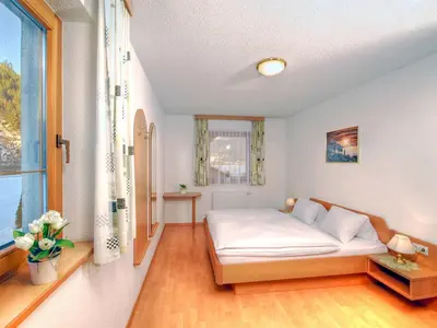 Ein Bett oder Betten in einem Zimmer der Unterkunft Apartment Sonnenau