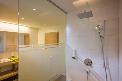 Ein Badezimmer in der Unterkunft Aparthotel AlpTirol