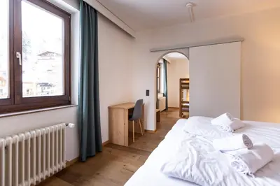 Ein Bett oder Betten in einem Zimmer der Unterkunft Hotel Pinzgauerhof - Inclusive Evening Dinner