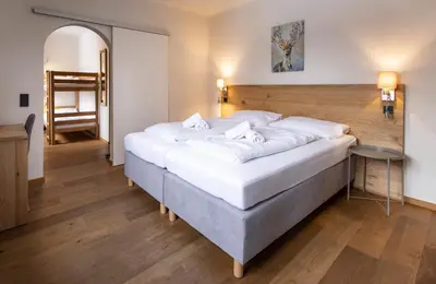 Ein Bett oder Betten in einem Zimmer der Unterkunft Hotel Pinzgauerhof - Inclusive Evening Dinner