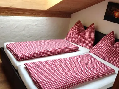 Ein Bett oder Betten in einem Zimmer der Unterkunft Appartement Kitzbühel mit Dachterrasse