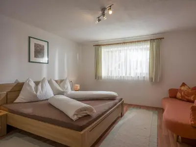 Ein Bett oder Betten in einem Zimmer der Unterkunft Gästehaus Schwaiger - Wiesenweg