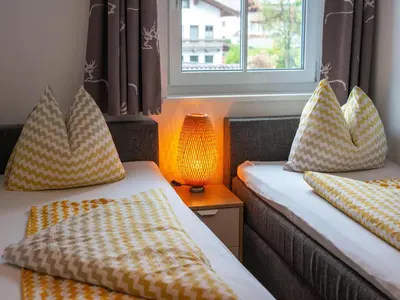 Ein Bett oder Betten in einem Zimmer der Unterkunft Modern Apartment near Ski Area in Brixen im Thale