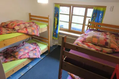 Ein Bett oder Betten in einem Zimmer der Unterkunft SnowBunnys BackPackers Hostel