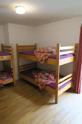 Ein Bett oder Betten in einem Zimmer der Unterkunft SnowBunnys BackPackers Hostel