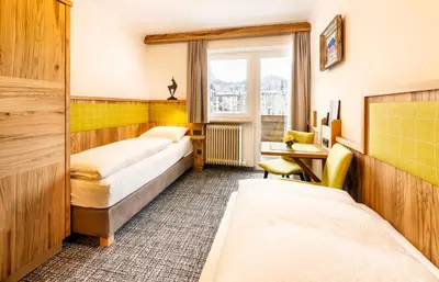Ein Bett oder Betten in einem Zimmer der Unterkunft Hotel Garni Entstrasser