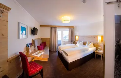 Ein Bett oder Betten in einem Zimmer der Unterkunft Hotel Garni Entstrasser