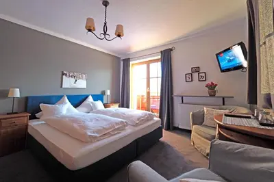 Ein Bett oder Betten in einem Zimmer der Unterkunft Pension Hinterseer
