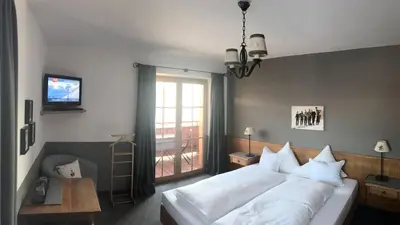 Ein Bett oder Betten in einem Zimmer der Unterkunft Pension Hinterseer