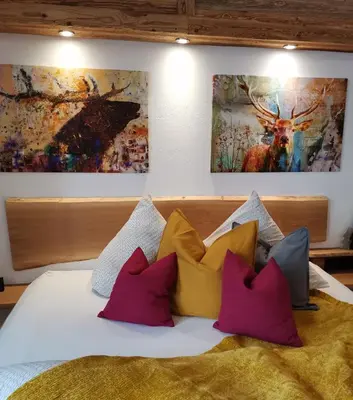 Ein Bett oder Betten in einem Zimmer der Unterkunft BERGHEIL Apartments